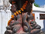Kathmandu Boudhanath 07-1 Dhyani Buddha Statues At Boudhanath Entrance A set of four Dhyani Buddhas carved in one piece of stone greets you just after entering the Boudhanath Stupa near Kathmandu. On the left is Amitabha, the Dhyani Buddha of the west, and on the right Ratnasambhava, the Dhyani Buddha of the south.